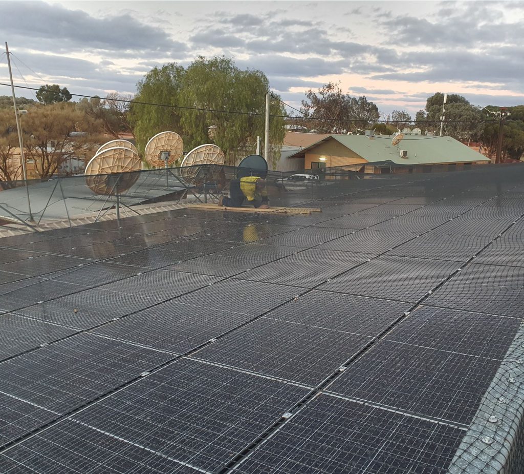 Netting protected solar PV array in the Western Australian Outback town of Tjuntjunjara